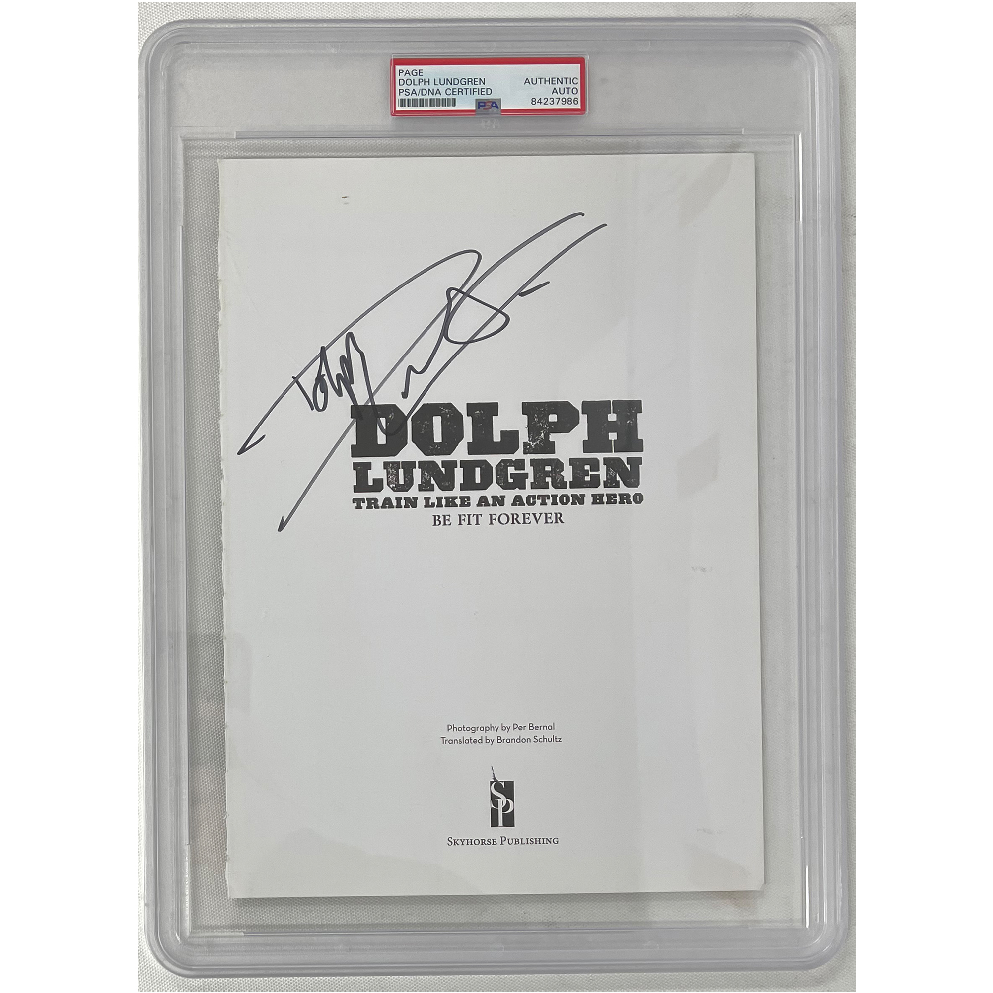 DOLPH LUNGREN Signed 8×10 Book Page PSA Encapsulated